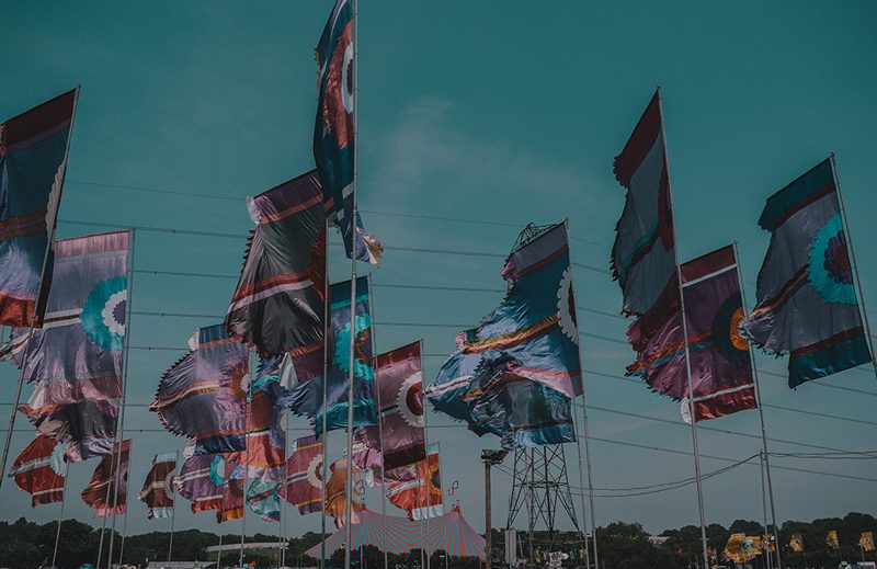 Flags against a teal sky