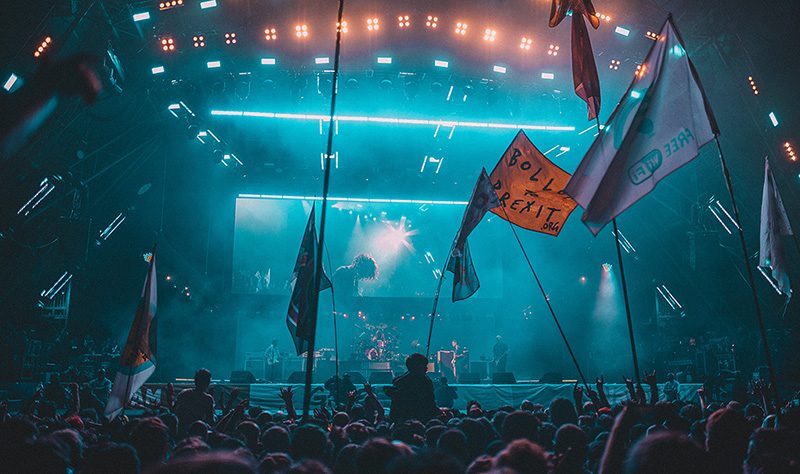 Stage and flags in teal light